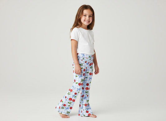 Child wearing blue cherry flares walking showing movement and flare